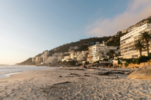 Modern apartment buildings along the Cape Town coastline representing rental property investment opportunities in South Africa